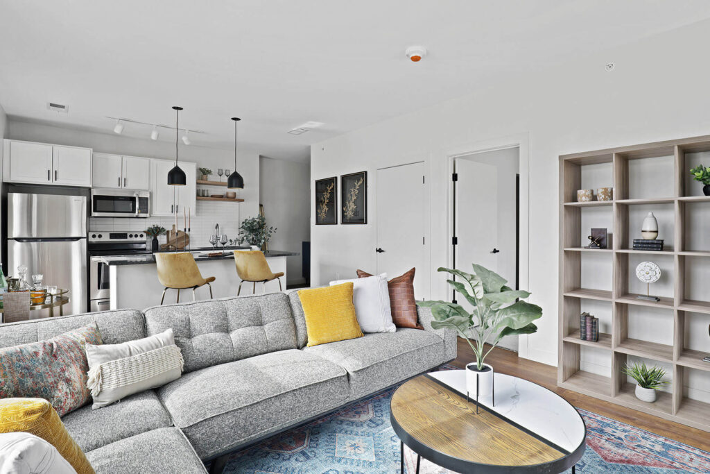 furnished living room and kitchen area in Dewey Park Apartments