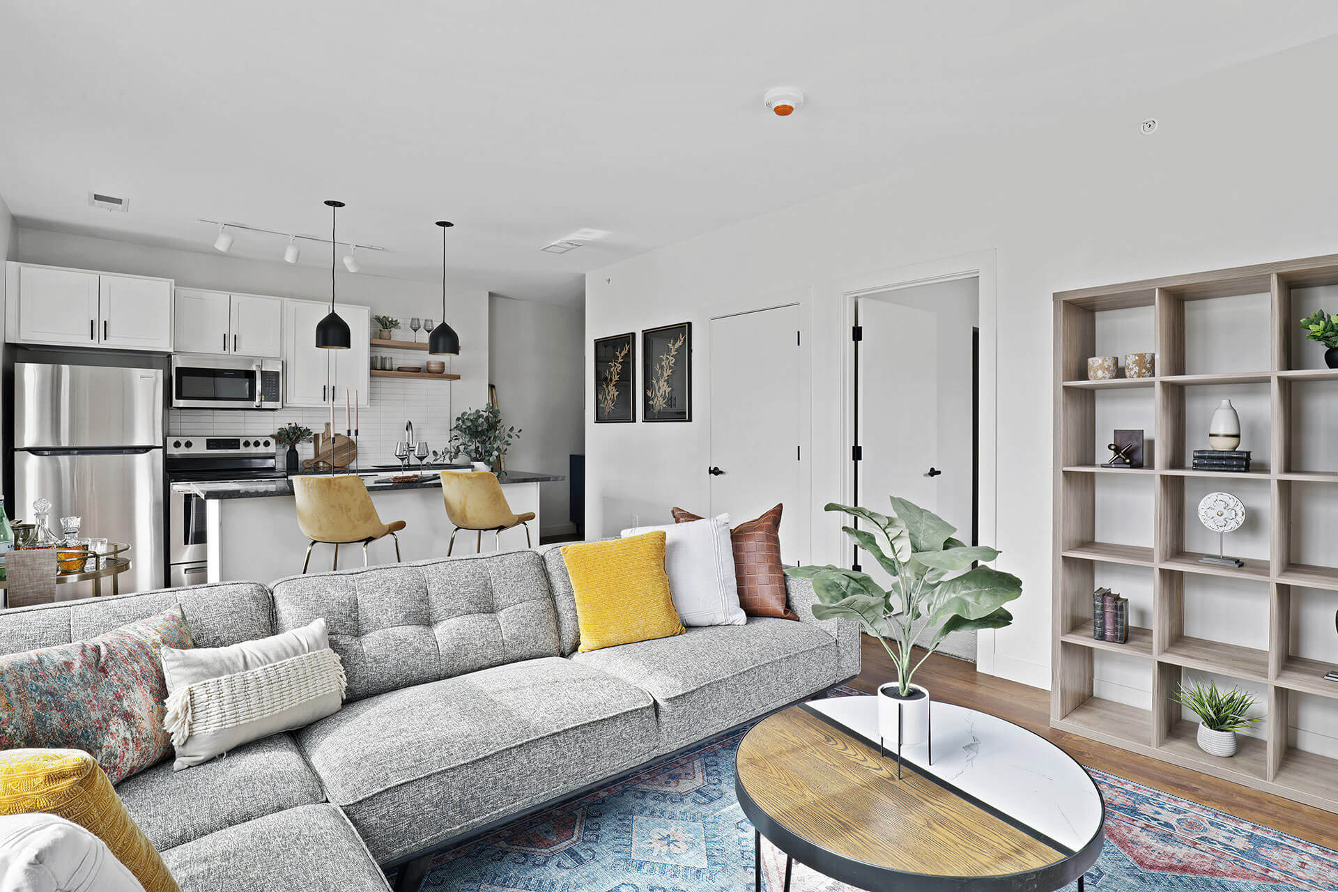 furnished living room and kitchen area in Dewey Park Apartments