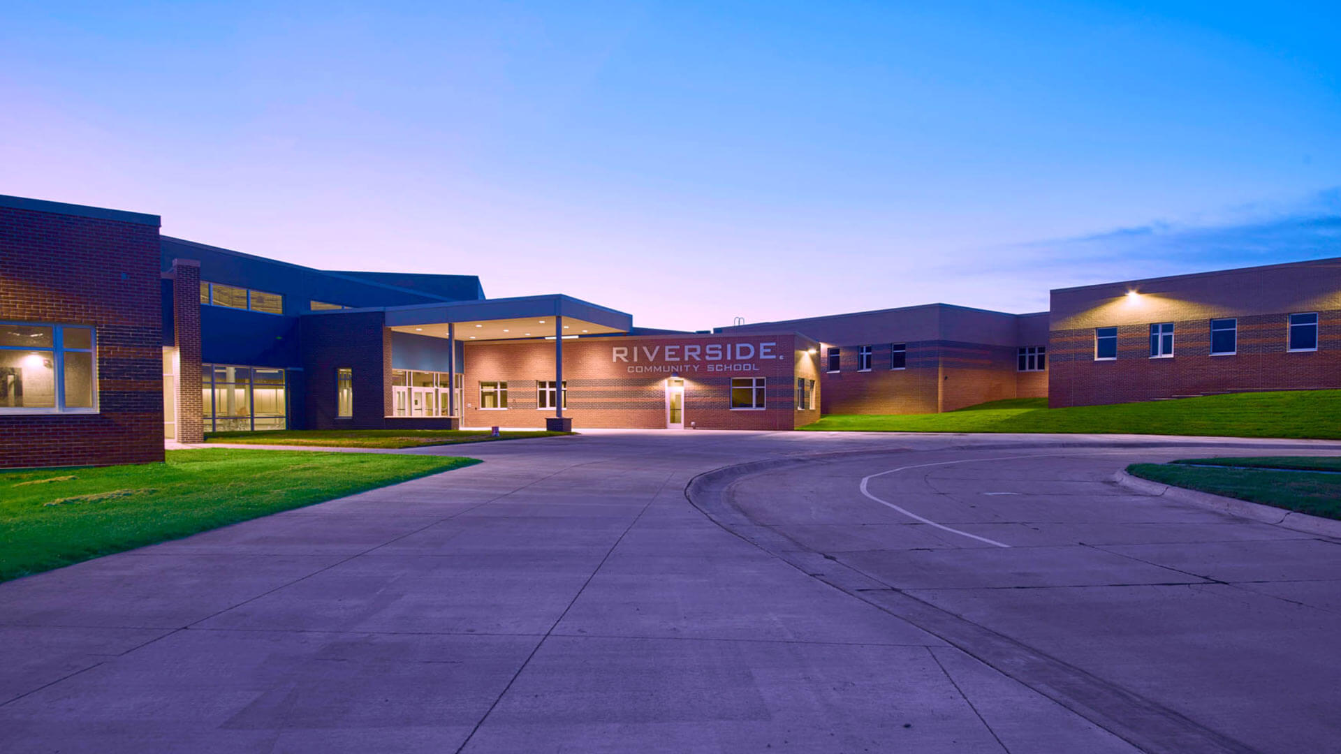 photo of main entrance of Riverside Community School at dusk